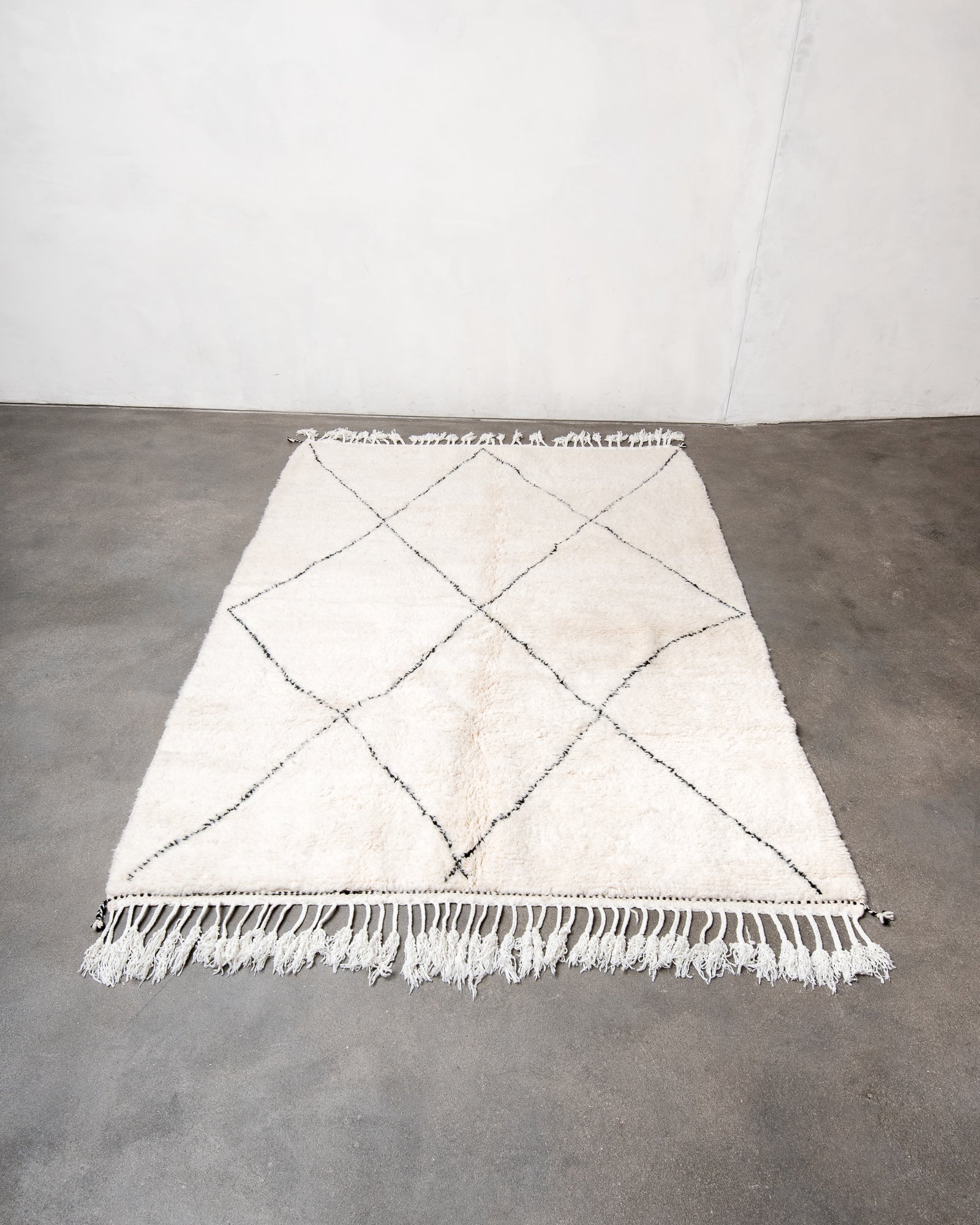 Modern, designer, handcrafted Berber rug from Morocco. Beniourain carpet with beautiful colours and patterns and fluffy wool texture.